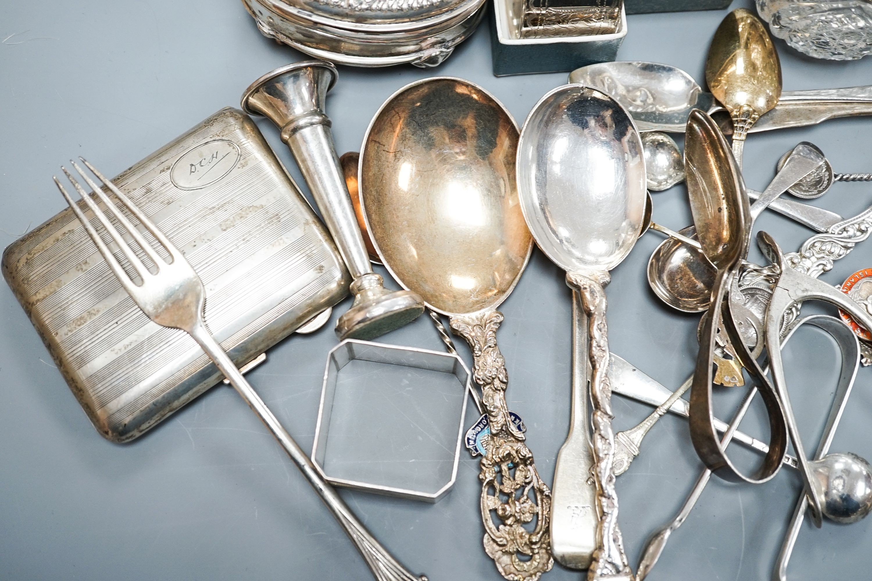 A mixed collection of sundry English and other silver to include a cigarette case, wishbone sugar nips, scent bottle, mixed cutlery, napkin rings, trinket box, etc. (some a.f.) and some plated items.